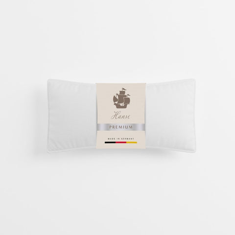 Verpackter Premium 1-Kammer-Kissen Klassiker mit hochwertiger Produktbanderole für den Premium-Schlafbereich.