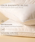 Nahaufnahme des Premium Kopfkissens Natural Hybrid mit atmungsaktivem Baumwollbezug, feiner weißer Biese und hochwertiger Verarbeitung.